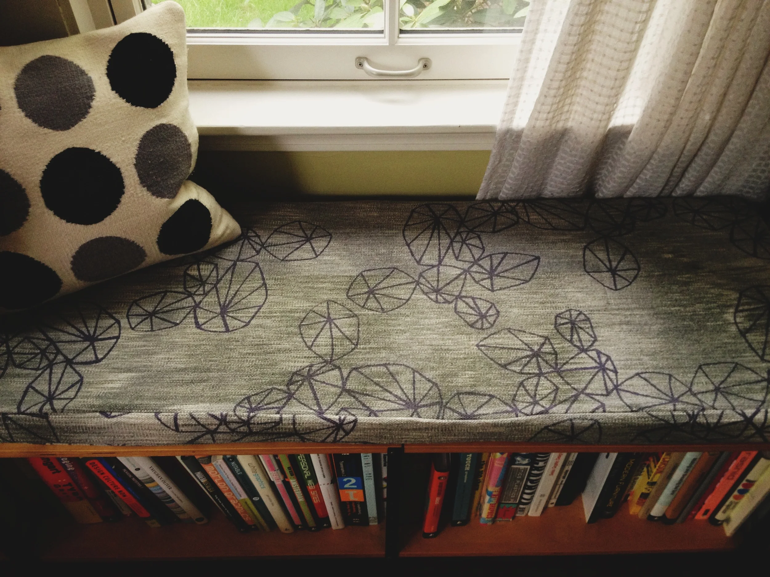  bench cushion upholstered with hand dyed, woven &amp; printed yardage. part of a matching set. 