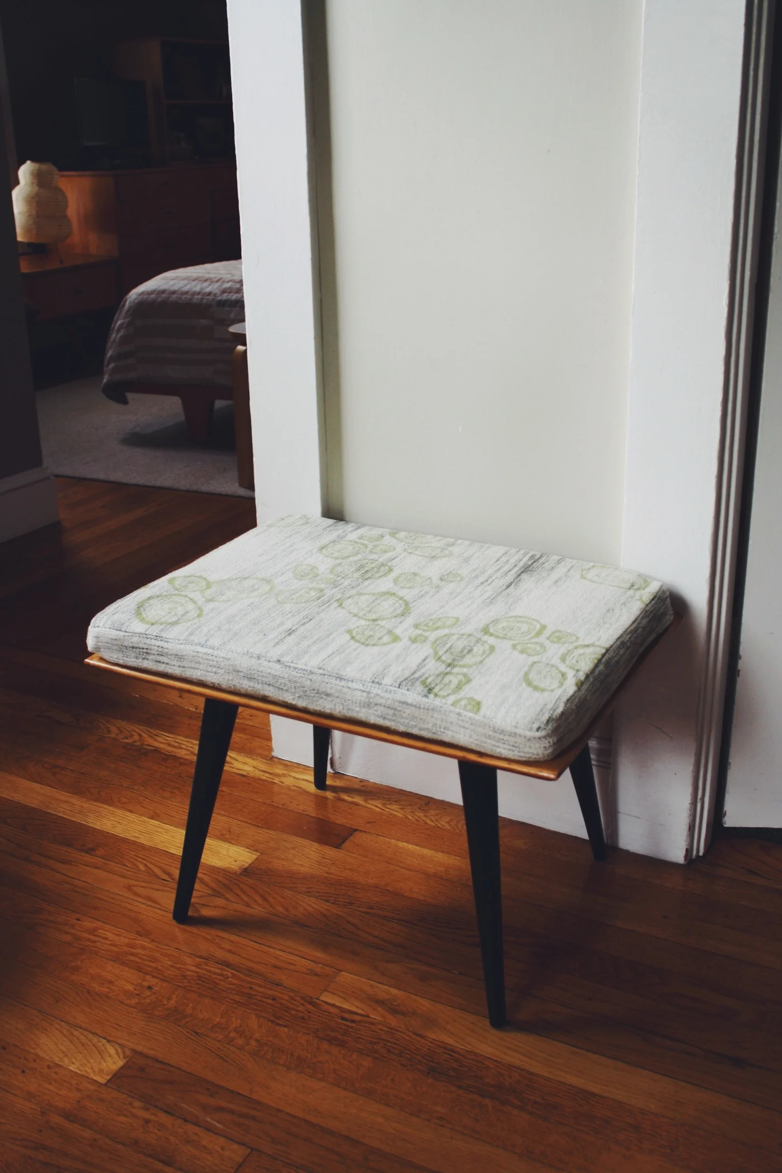  bench cushion upholstered with hand dyed, woven &amp; printed yardage. part of a matching set. 