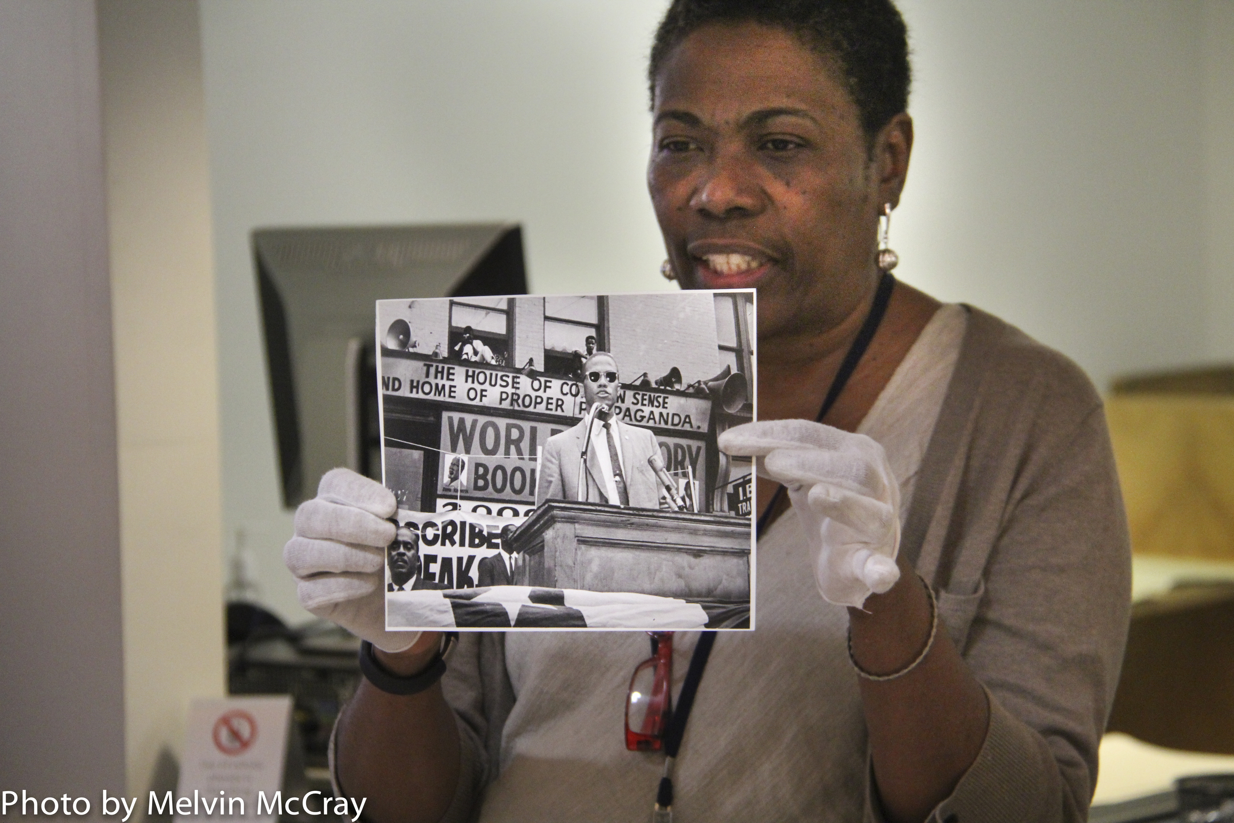 Mary Yearwood holds photo of Malcolm X-98.jpg