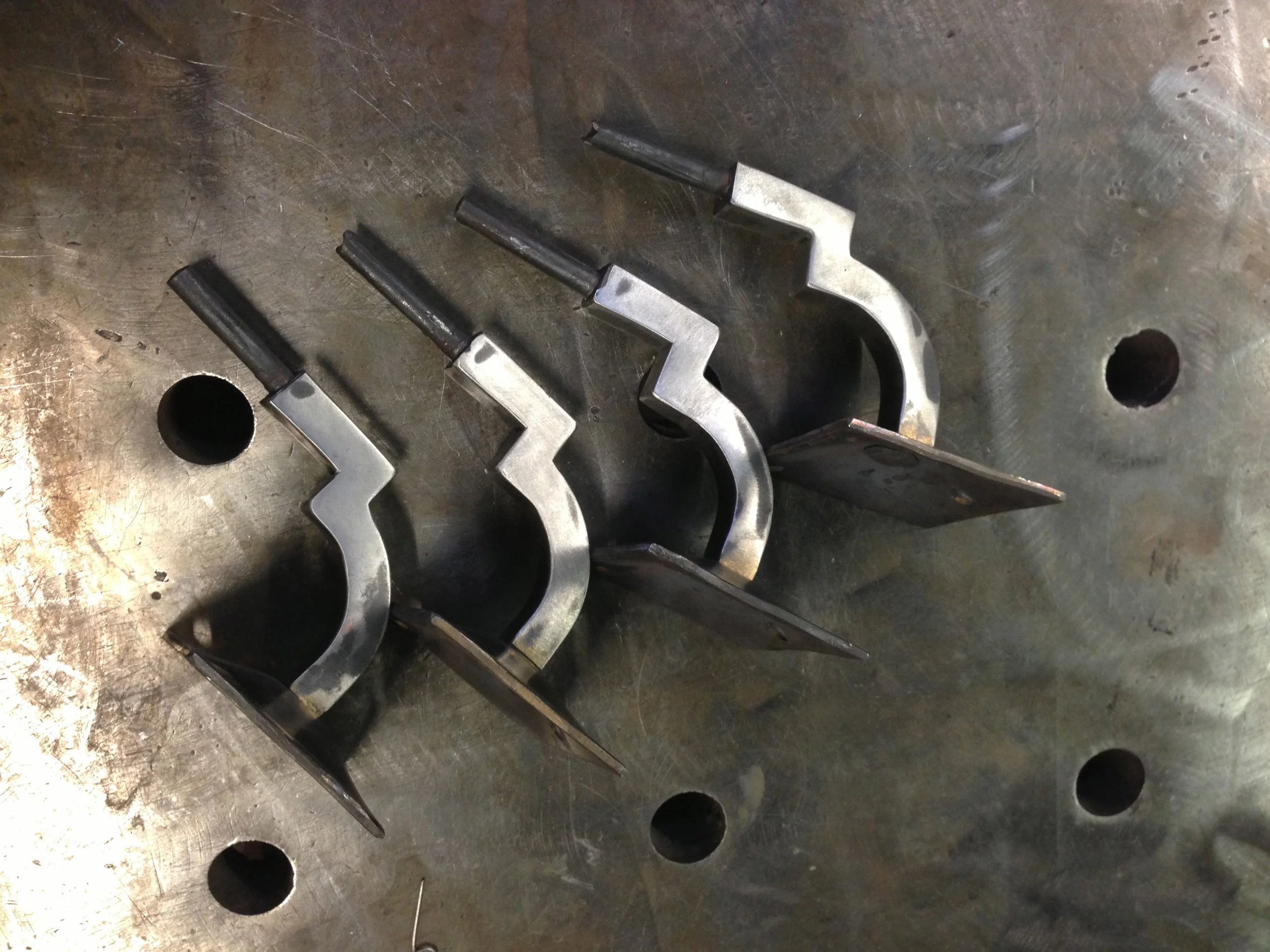 Forged stainless hand rail hangers