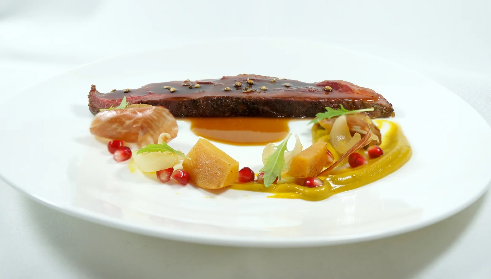2014 - iberico, pomegranate jus, fried coriander, persimmon, pickled shallots, jamon, arugula.jpg