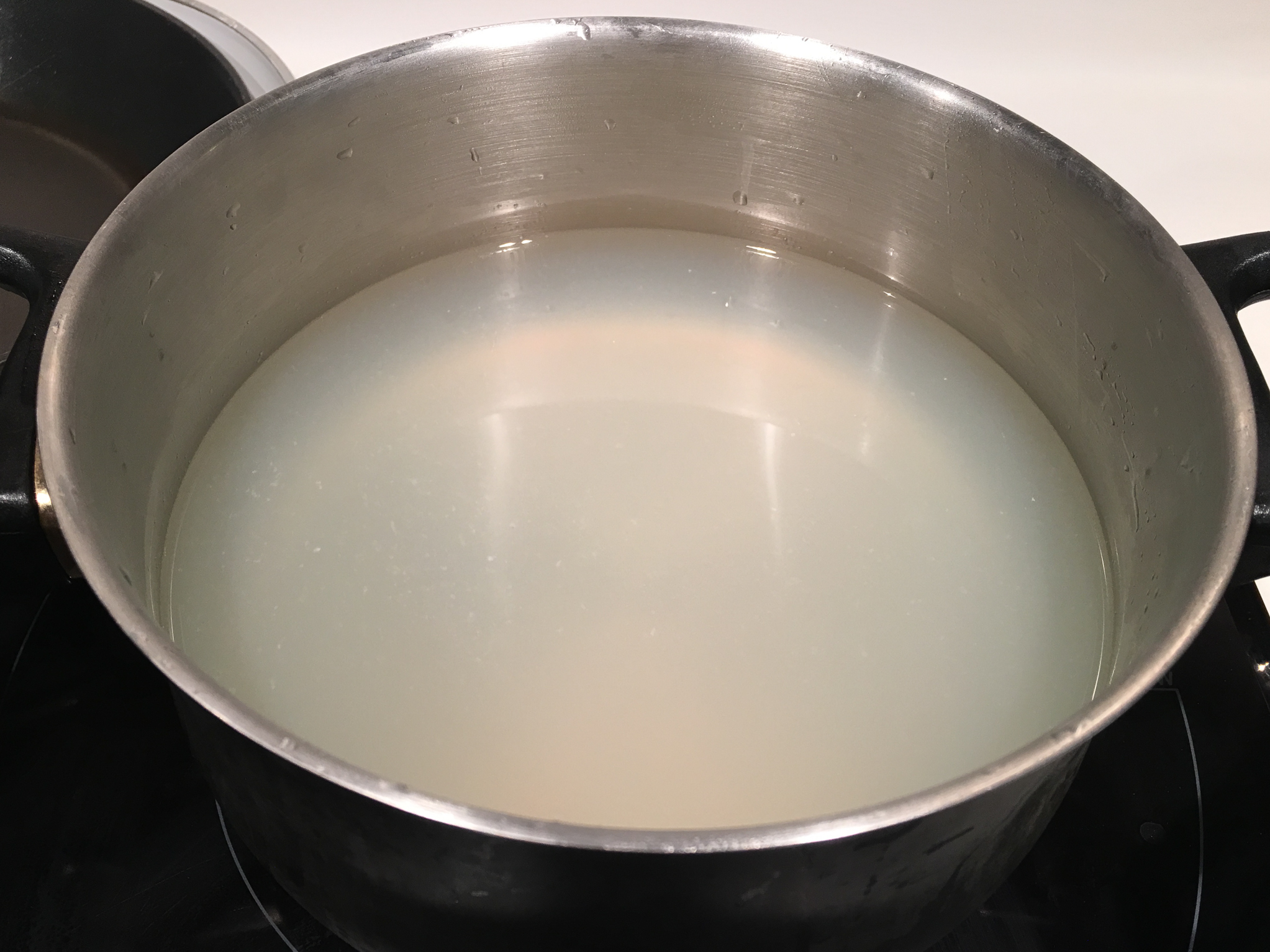Freshly extracted clam juice. The clams are a good snack while preparing pho.