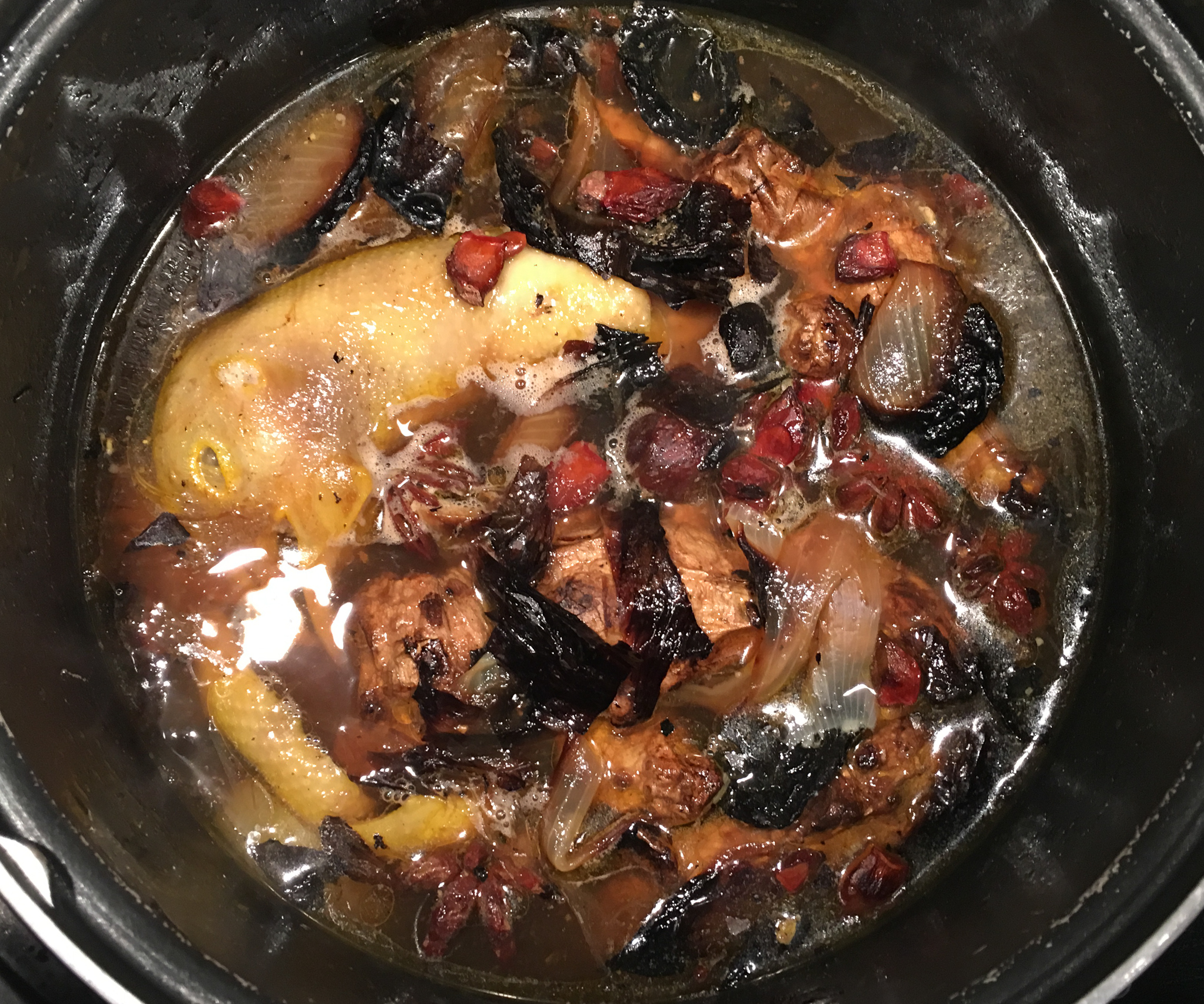 Broth steeped with chicken bones, feet, spices, and burnt ginger & onion.
