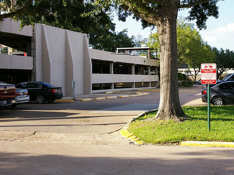 Turn right into parking lot from Wild Indigo Street.