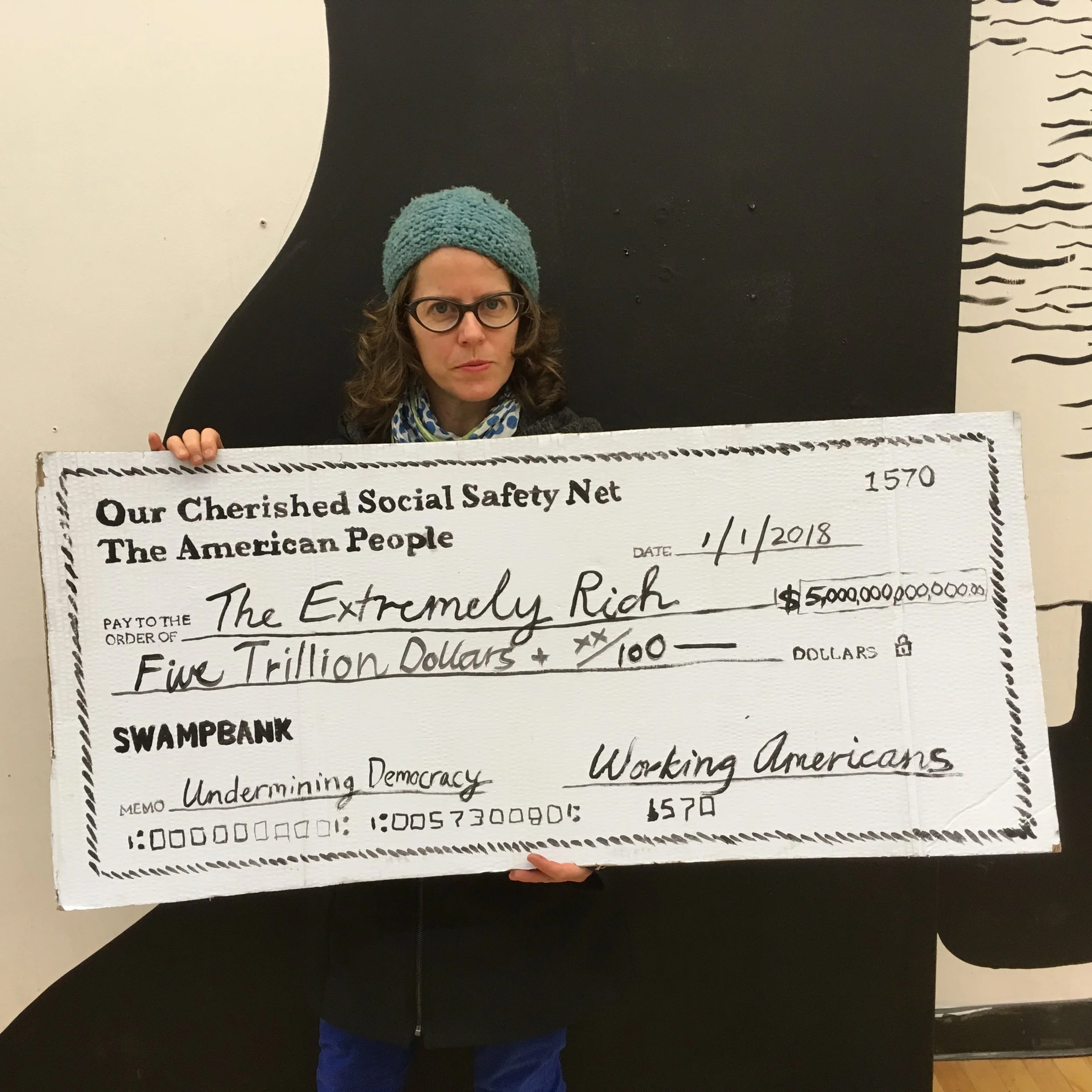 I worked on the check idea with Bryony Romer and others from the Safety Nets group at Get Organized Brooklyn (they made the awesome checks and had the idea to have people pose with them and post to their social media networks.)