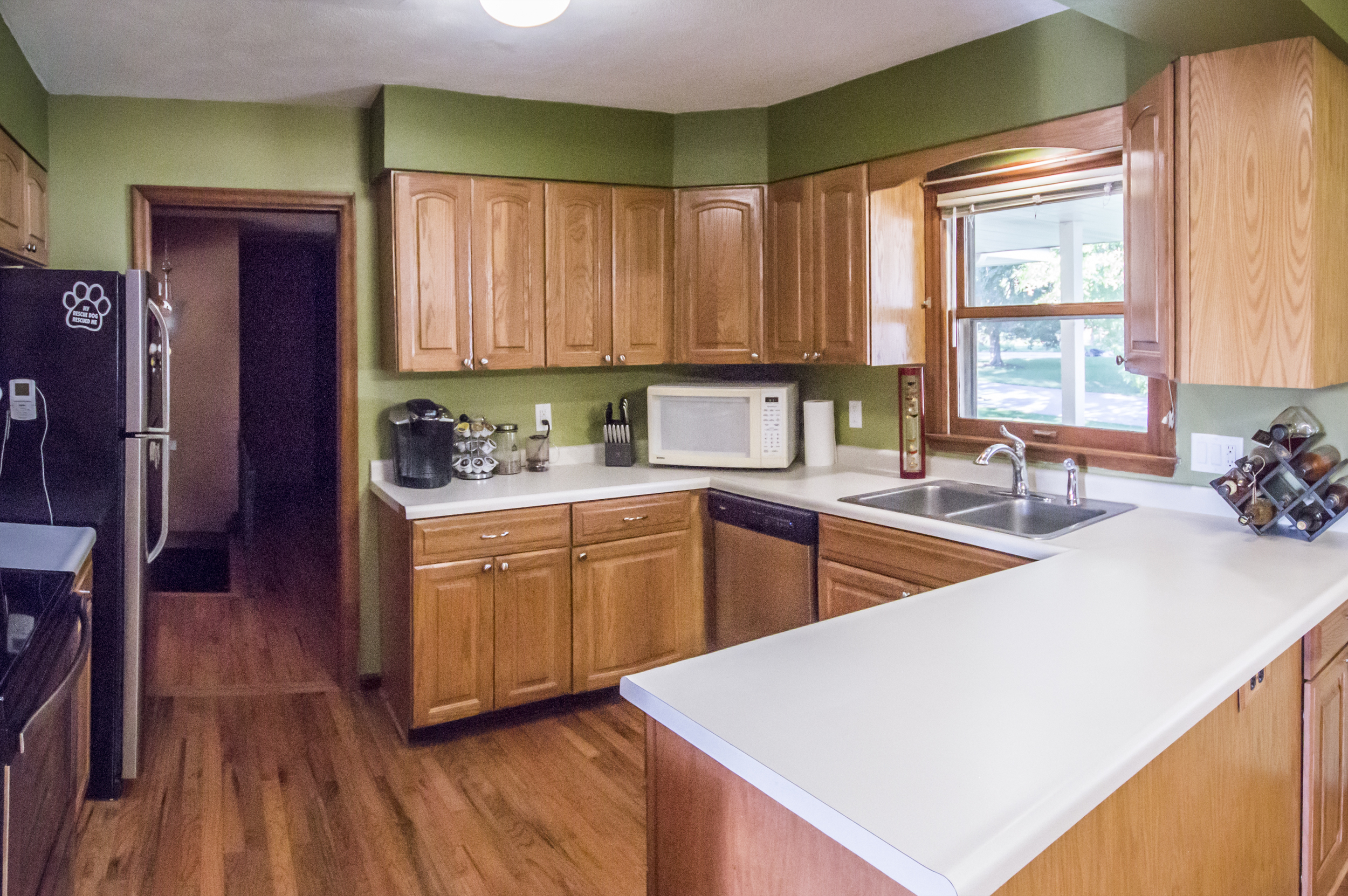 Changed: Green paint (darker green above cabinets), personal appliances.