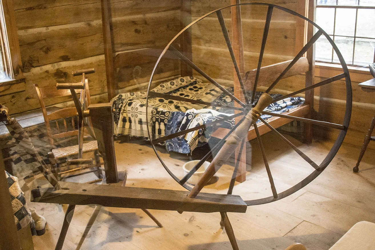 The cabin's display featured an old spinning wheel and a swift!