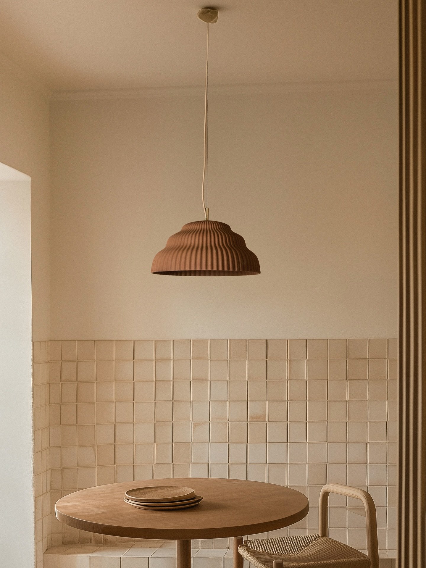 Kaskad reinterprets the pendant lamp as landscape - its cascading profile cast in ceramic with refined precision, evoking stillness, tactility, and a gentle spatial rhythm.