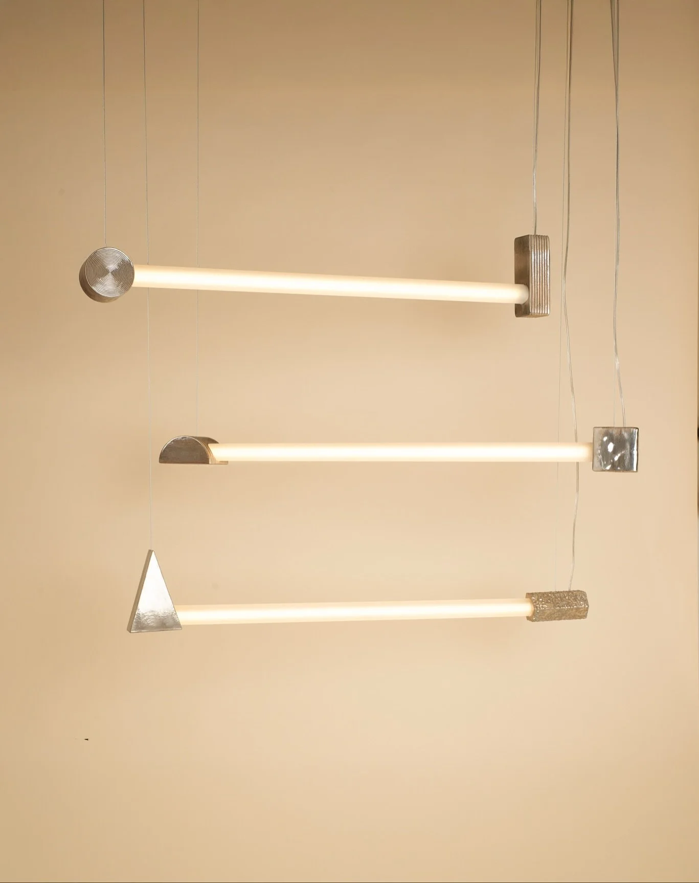 Between the Ends is a light shaped in the in-between, where fragility meets resilience, where endings and beginnings blur. Through glass and ceramic, smoothness and erosion, we&rsquo;ve created a piece that holds light like a fragile echo between wha