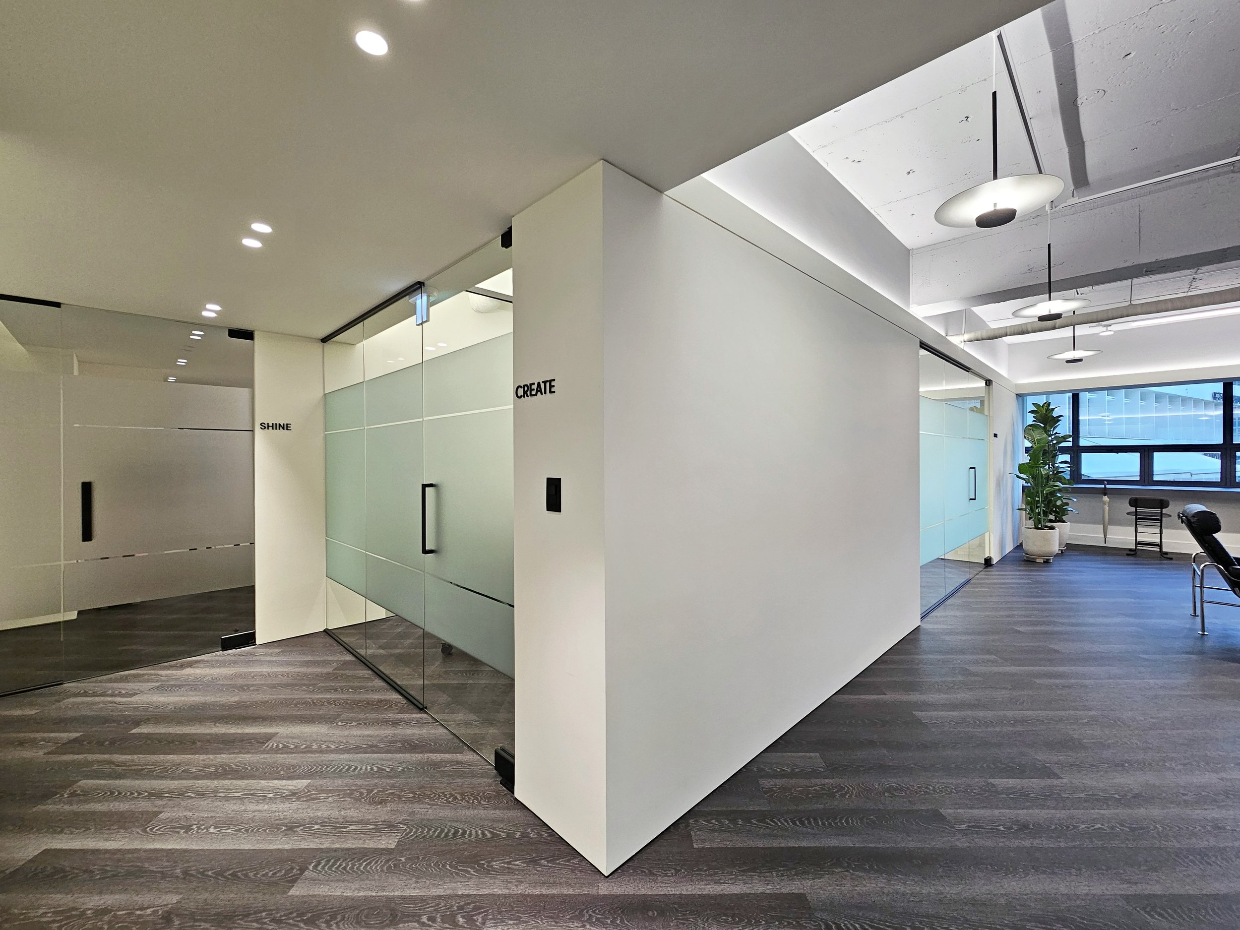 Corner view of the conference room zone from the entry corridor