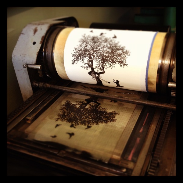 Close-up of the polymer plate and the print on the press.
