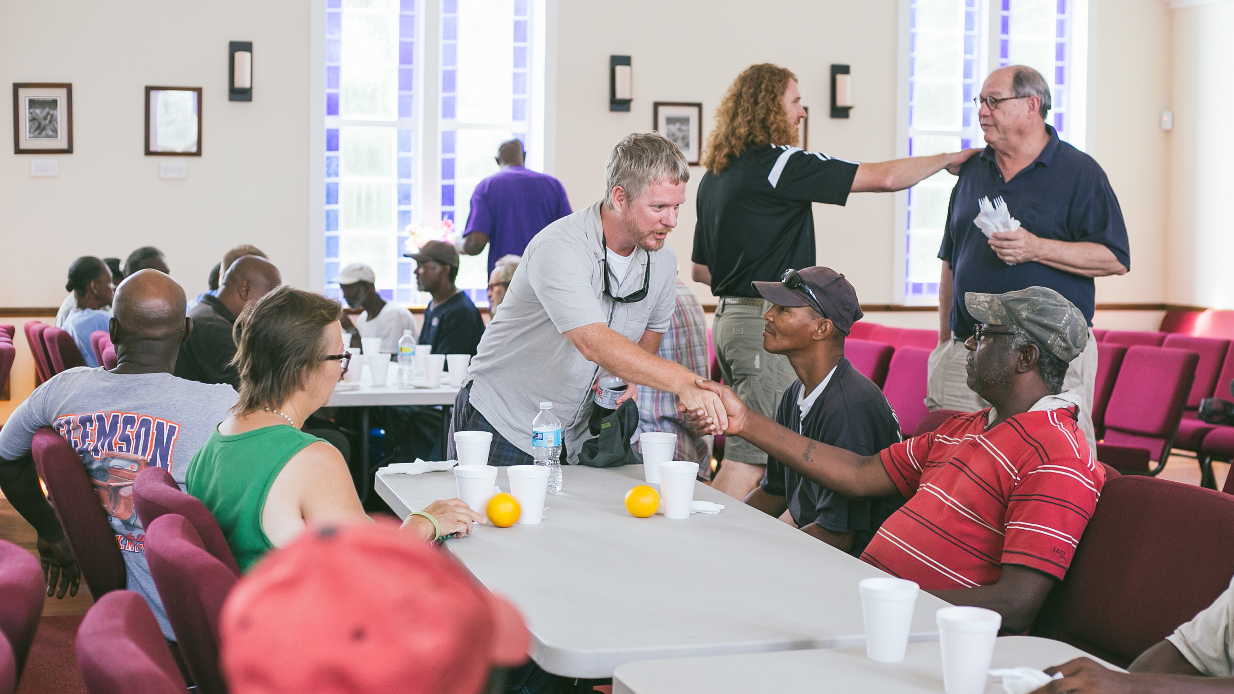 Members serving and connecting during our monthly brunch ministry at St. John's Chapel. Photos by Anna Warner, 2015