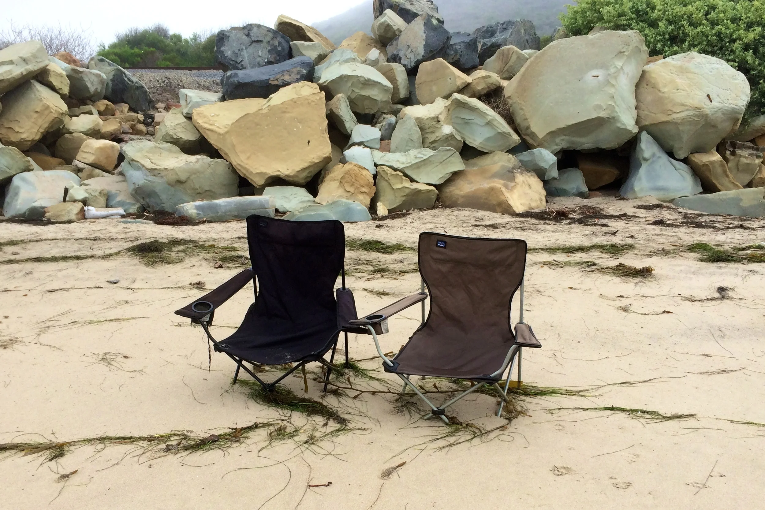 These chairs have obviously been here for a while. They are anchored in about a foot of sand. So wistfully abandoned.