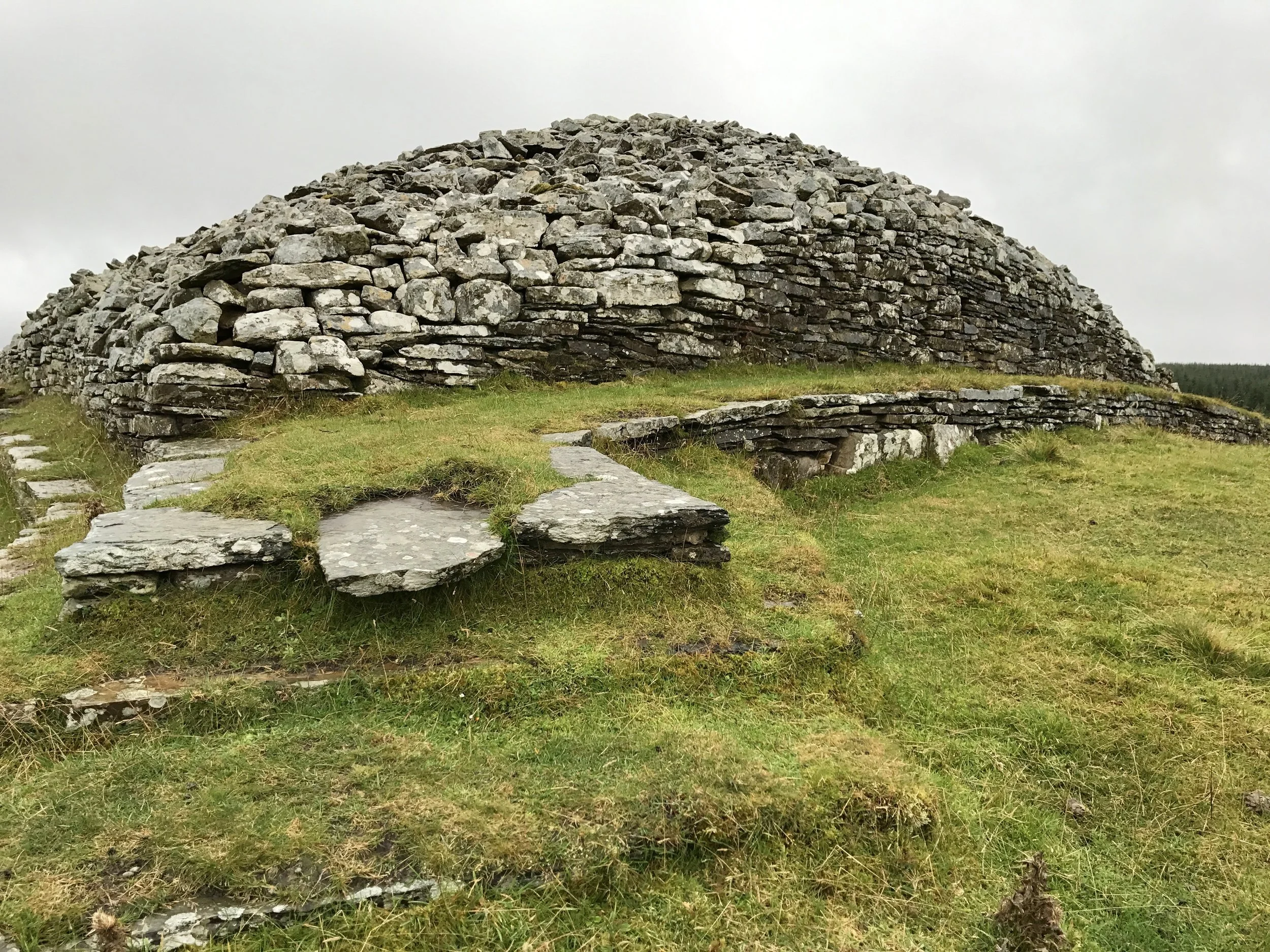 Outside a Neolithic cairn. In particular, the Grey Cairns of Camster outside of Wick.