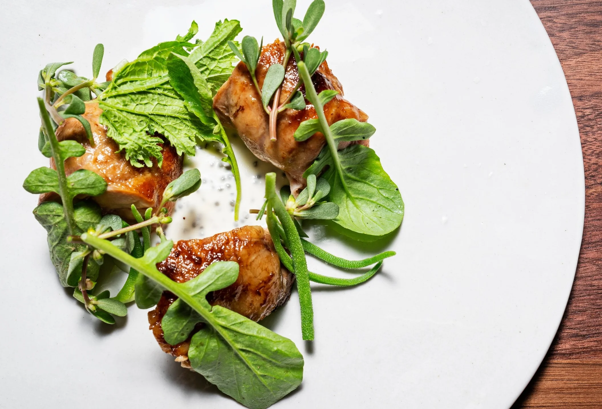 Sweetbreads, or organ meat, with spinach, bitter greens and paddlefish roe.