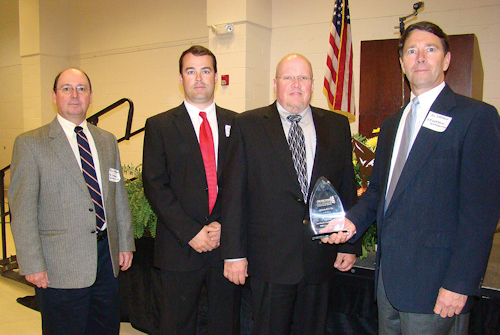 ACCEPTING THE AWARD ARE (LEFT TO RIGHT) DOUG CHESSON, ZACK MIXON, ED POWELL AND AL CHESSON. (PHOTO BY BRENDA MONTY OF THE ENTERPRISE)
