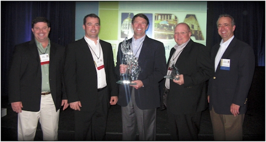 ACCEPTING THE AWARD AND ARTISAN CRYSTAL SCULPTURE FROM A. R. CHESSON CONSTRUCTION COMPANY, INC. ARE (LEFT TO RIGHT) KIRK NIXON, ZACK MIXON, AL CHESSON, AND ED POWELL ALONG WITH DELVIN WARNER, PRESIDENT OF METALLIC BUILDING COMPANY.