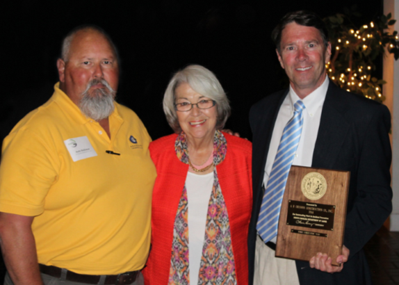 Pictured from left to right are Andy Holliman, Corporate Safety Director; NCDOL Commissioner Cherie Berry; and Al Chesson, President.