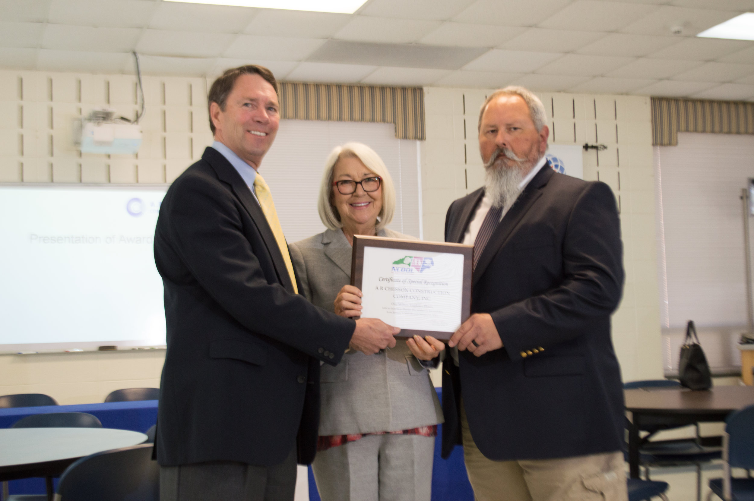 Al Chesson and Andy Holliman receiving One Million Hour Award from NC Commisioner of Labor Cherie Berry
