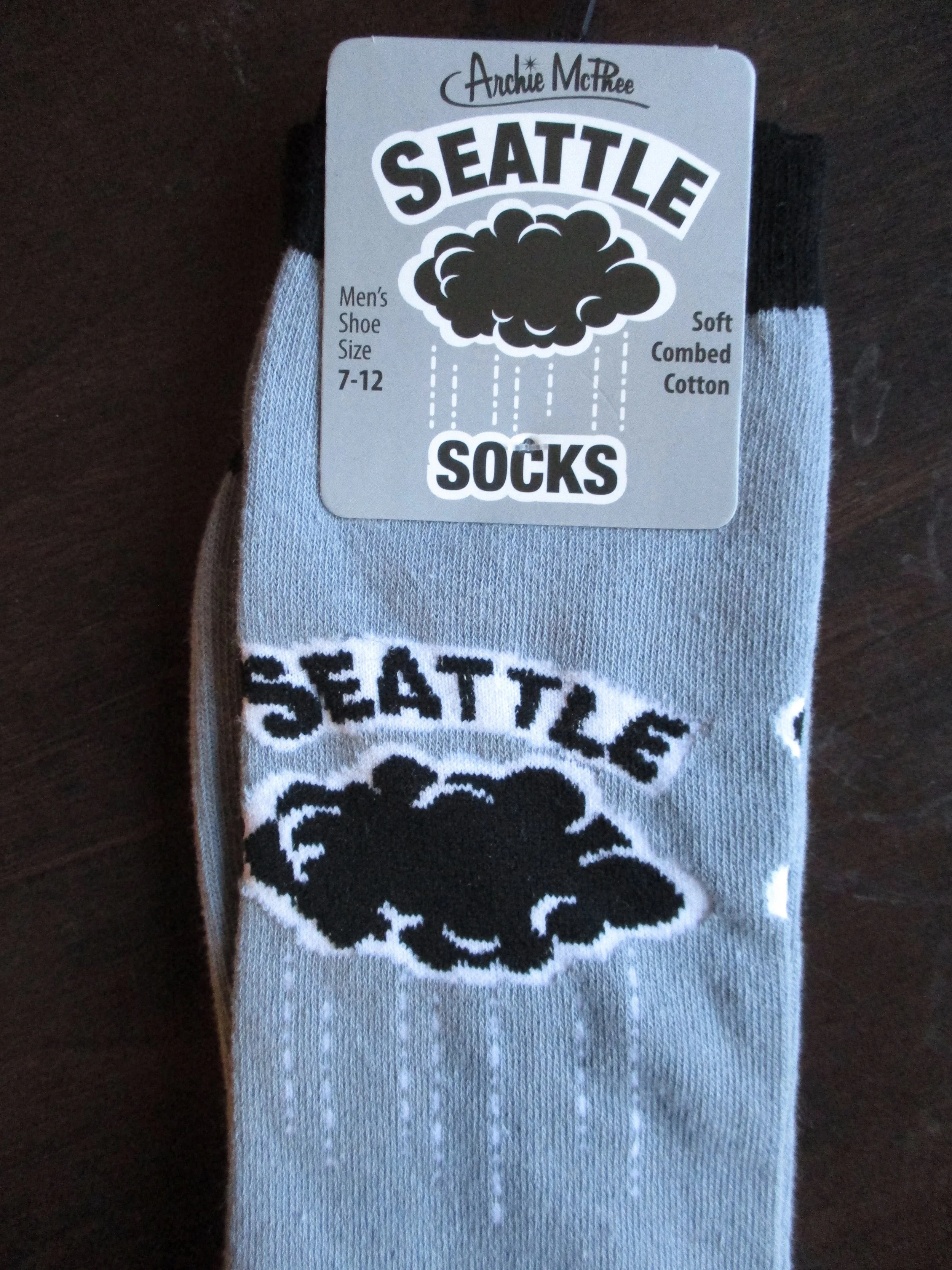 Look at these very dark, scary rain clouds from Seattle. No need to criticize the accuracy of the cloud here (it's "art" on a pair of socks, after all) but I will defend the clouds' reputation by reminding everyone that Seattle, Washington, isn't all that rainy. It's less rainy than Miami and several other U.S. cities. What Seattle has is clouds--not always rain clouds--but clouds. Lots of them.