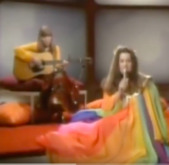 Saving the best for last here... PLEASE PLEASE click here to watch Joni Mitchell singing her song "Both Sides Now" on the Mama Cass TV show in 1969. Perhaps unwittingly, Mama Cass is wearing an outfit that shows her uncanny (or unwitting?) understanding of the sunlight and visible spectrum ;)
