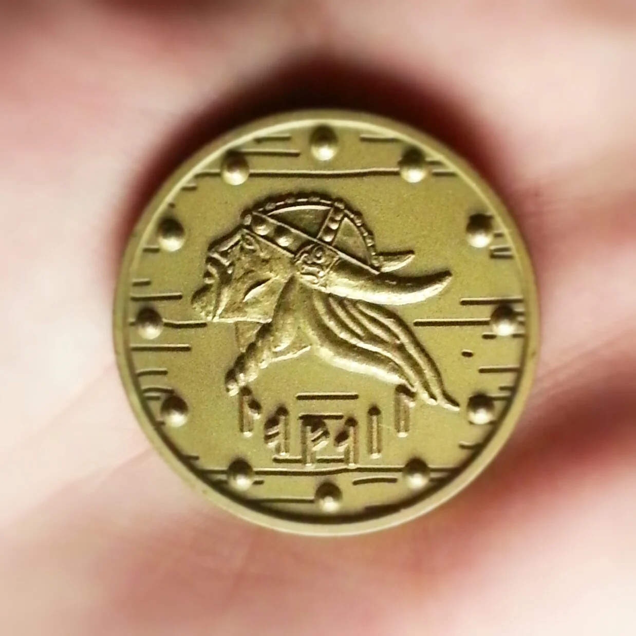 A coin given by the United States Naval Academy, the writing is Nordic for "Never fail".