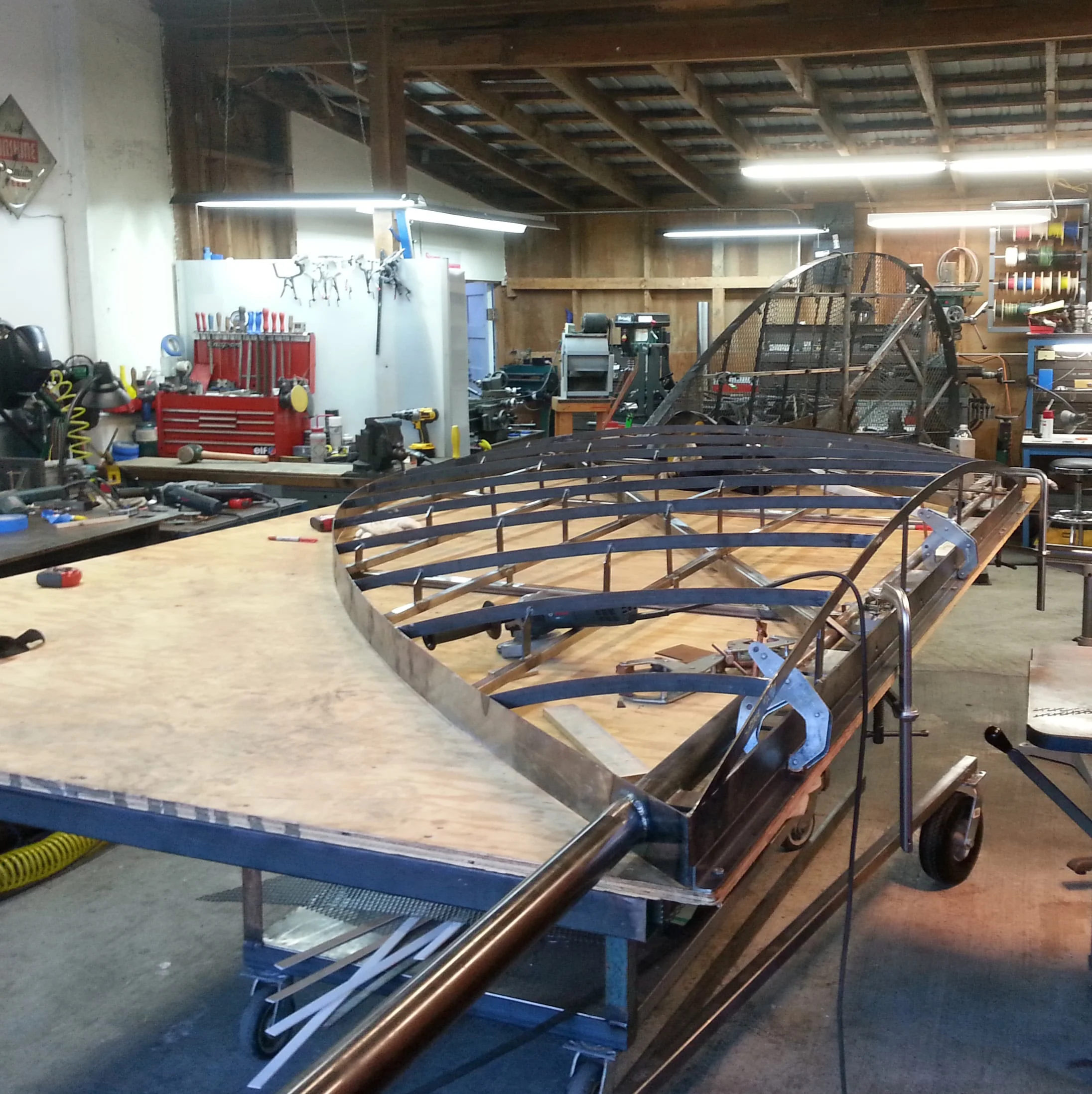 The curved ribs in welded in position as well as the outer edge shape, the edge on the right is the seam where the two halves will be bolted together.
