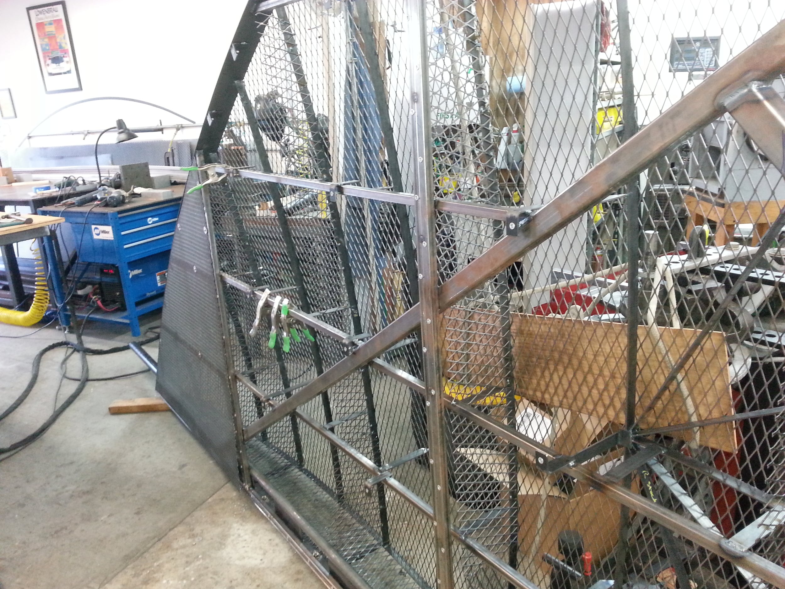 Metal work being done on the back panels of the heart, nutserts and stainless steel hardware secure the panels.