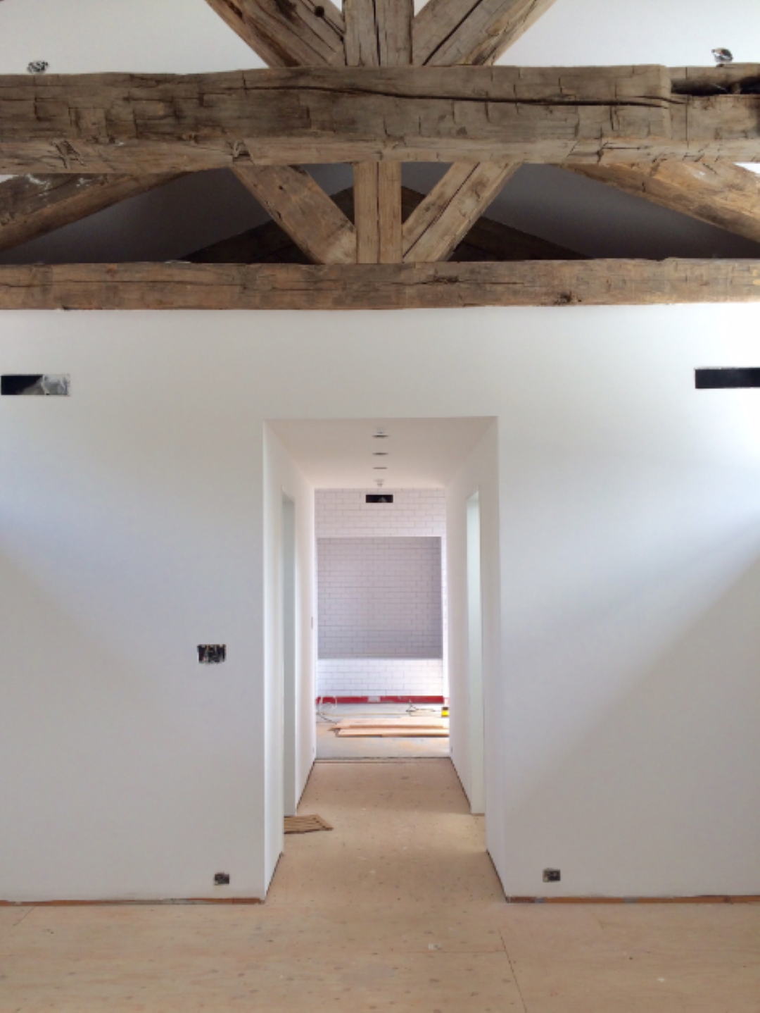 The Master Suite taking shape. CYNTHIA CARLSON ASSOCIATES sourced the reclaimed heavy timber used throughout the house from Northern California.