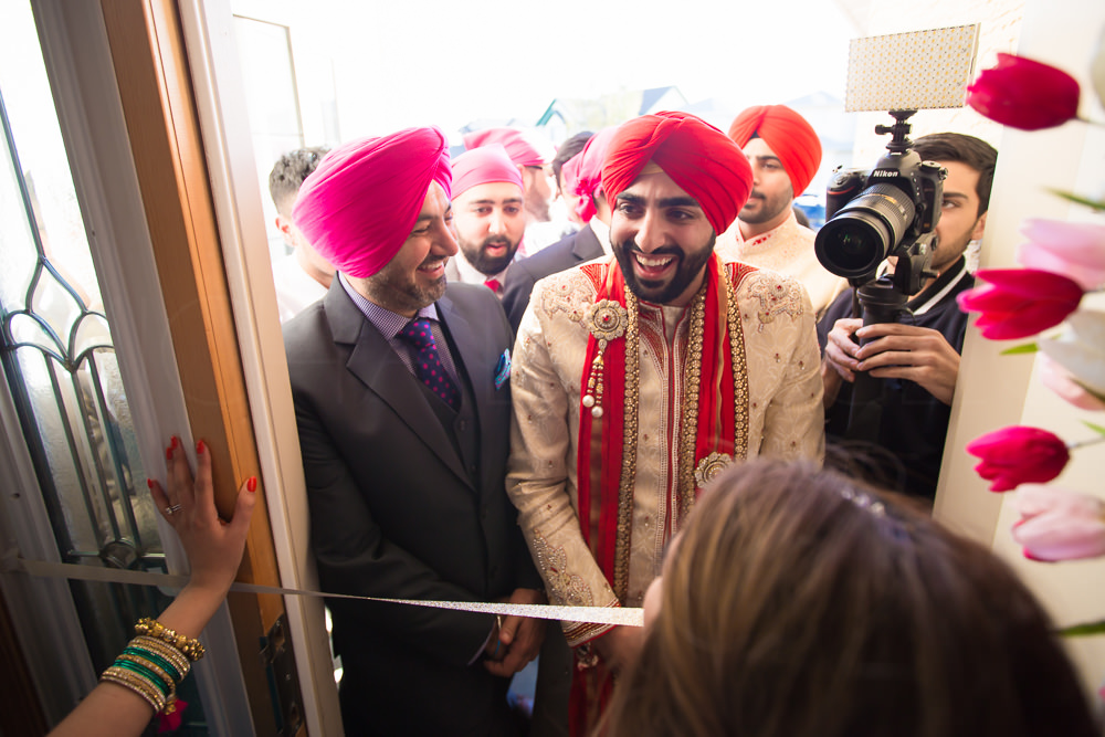 After the shoot, Janti and the bride separates. The groom and the groomsmen are left outside, and they can't enter the house without the payment for the pair of shoes.
