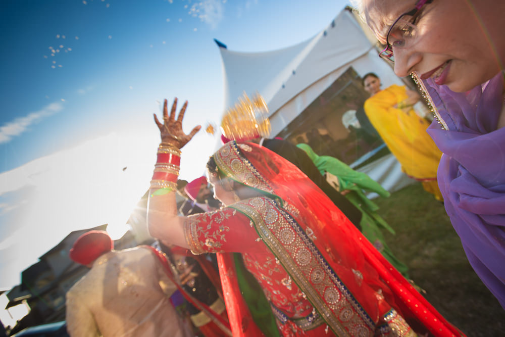 The bride throws phulian or puffed rice over her head. It means good wishes for her parents.