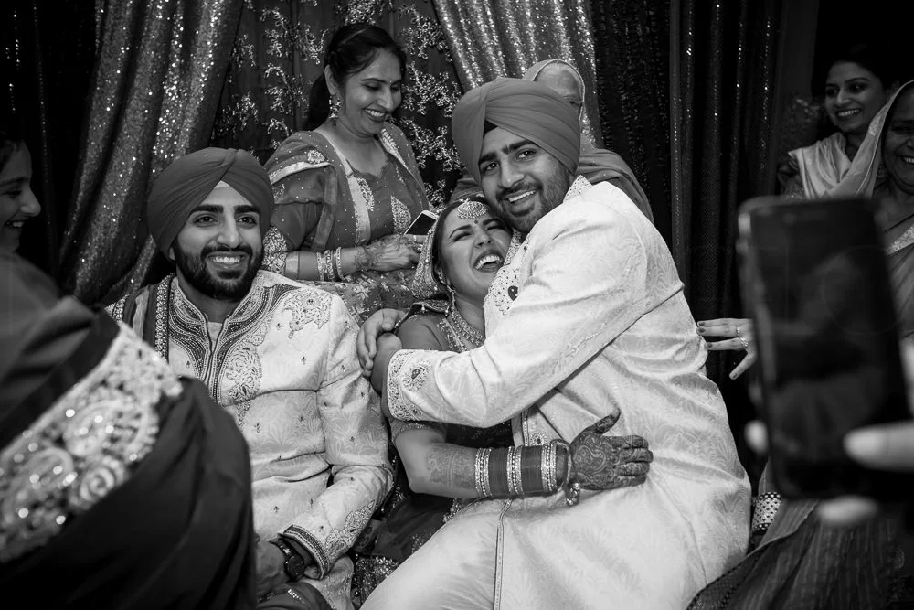 The groom's brother, hearing that they paid ransom for his shoes back at the bride's household, demands payment as well from the bride. The rest of the evening is now spent chatting and drinking and eating.