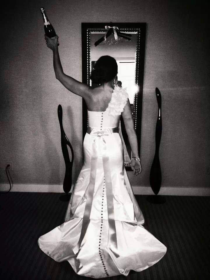 3. Yay!! Time to celebrate with Leslie's amazing champagne photo!! Love this, I might just have to do this one day myself... Leslie is wearing the Dionna trumpet cut gown & custom jewelry from the VSC Collection. This photo is gorgeous & I love how it highlights the beautiful bustle & Swarovski crystal buttons. Reception held at the Millennium Knickerbocker in Chicago . Photography: http://www.thinkleigh.com