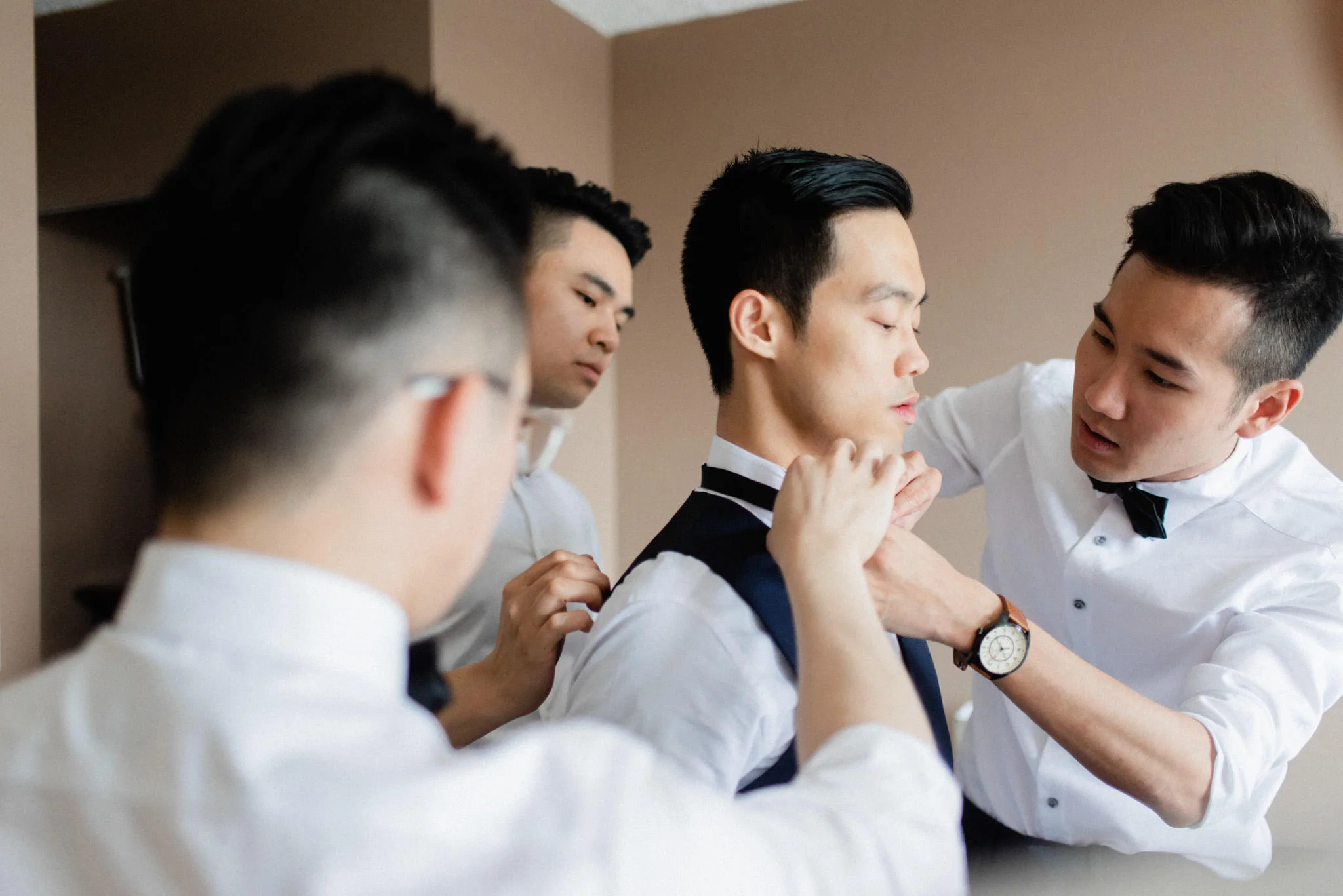 Groom getting ready for wedding at Hart House