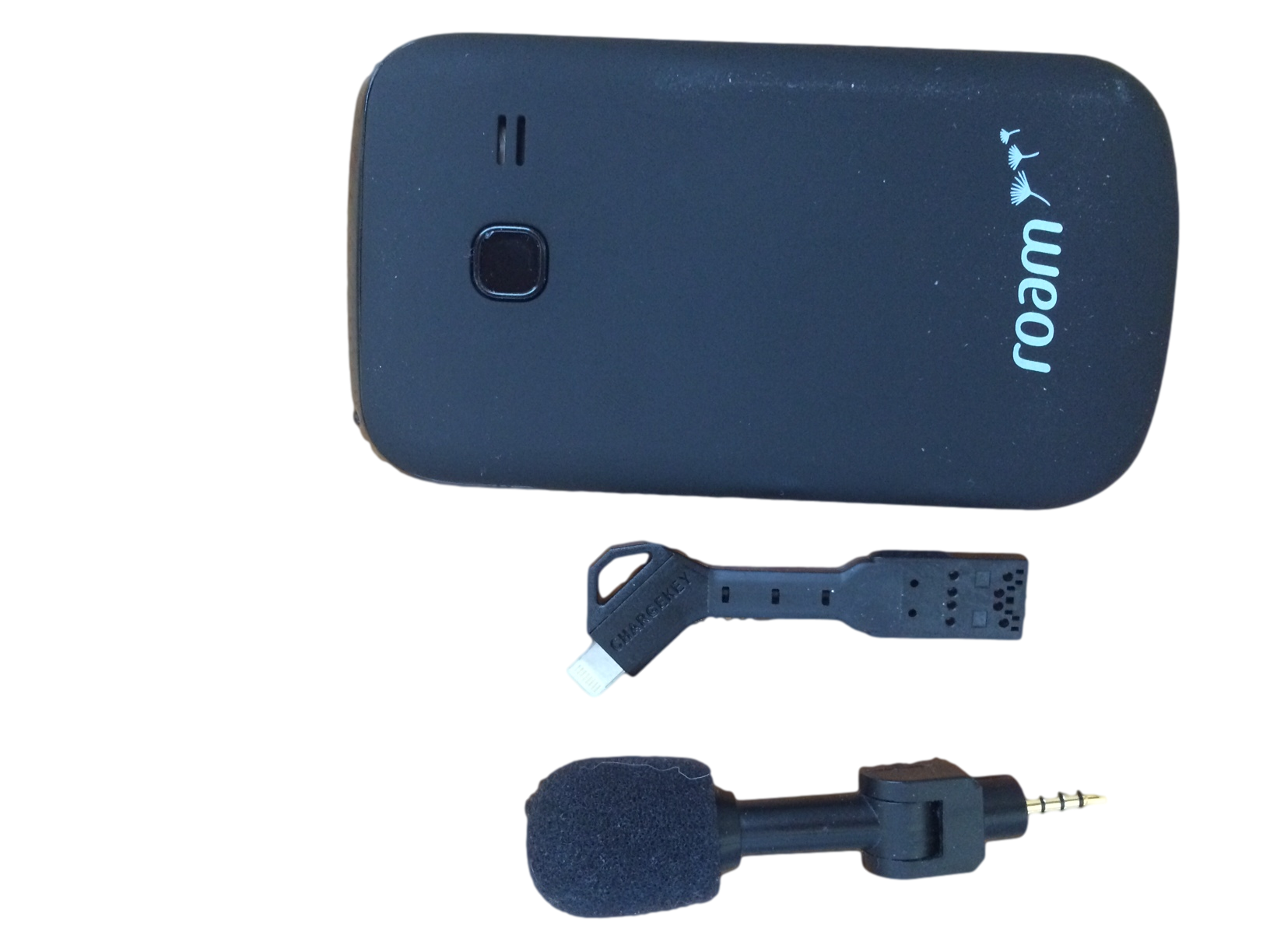 You can see the size comparison of the Chargekey compares to a Roam Mobility "dumb" phone and a portable iPhone microphone.