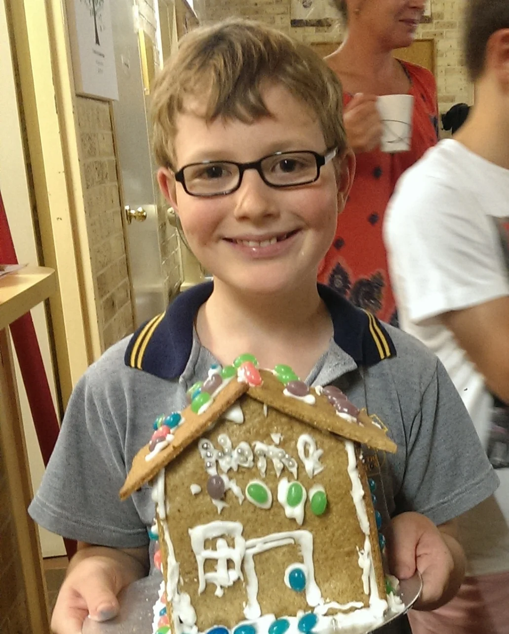 Another first this year: he made his gingerbread house with everyone else at our GB House making night. "Weren't you worried about the noise?" I asked. "Once I was doing it I was concentrating so hard that I didn't notice," he said.