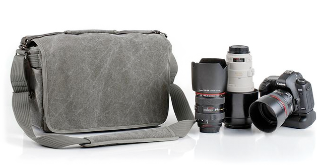 usually one body and 3 or 4 lenses and a flash. Also has room for a 15inch macbook