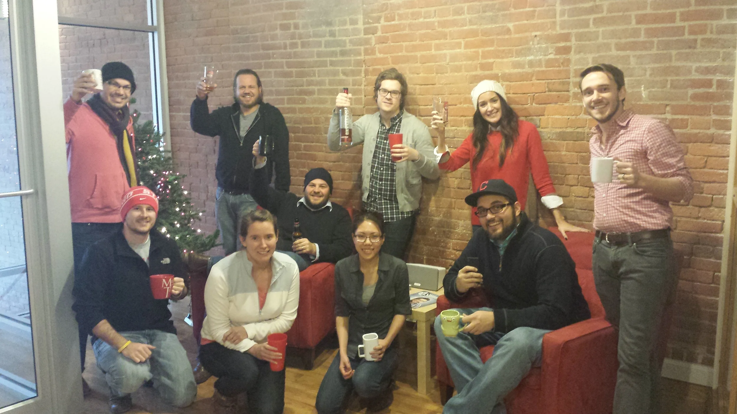 The Recess Team posing by the tree with some Cleveland Whiskey. 