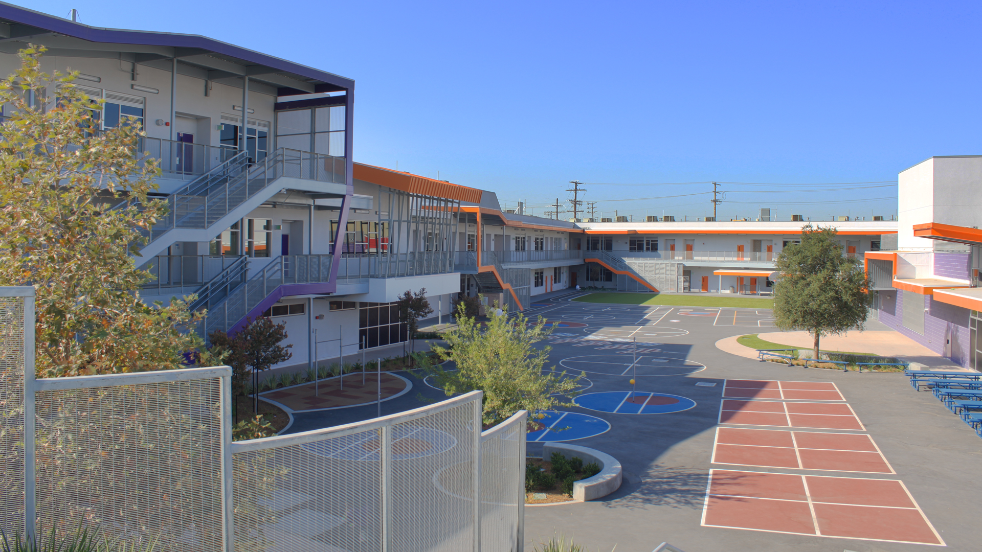 This is accented by the use of color – primary colors for the elementary school and secondary colors for the middle school. In addition, the main entry is also marked by the bold use of color on the library volume. 