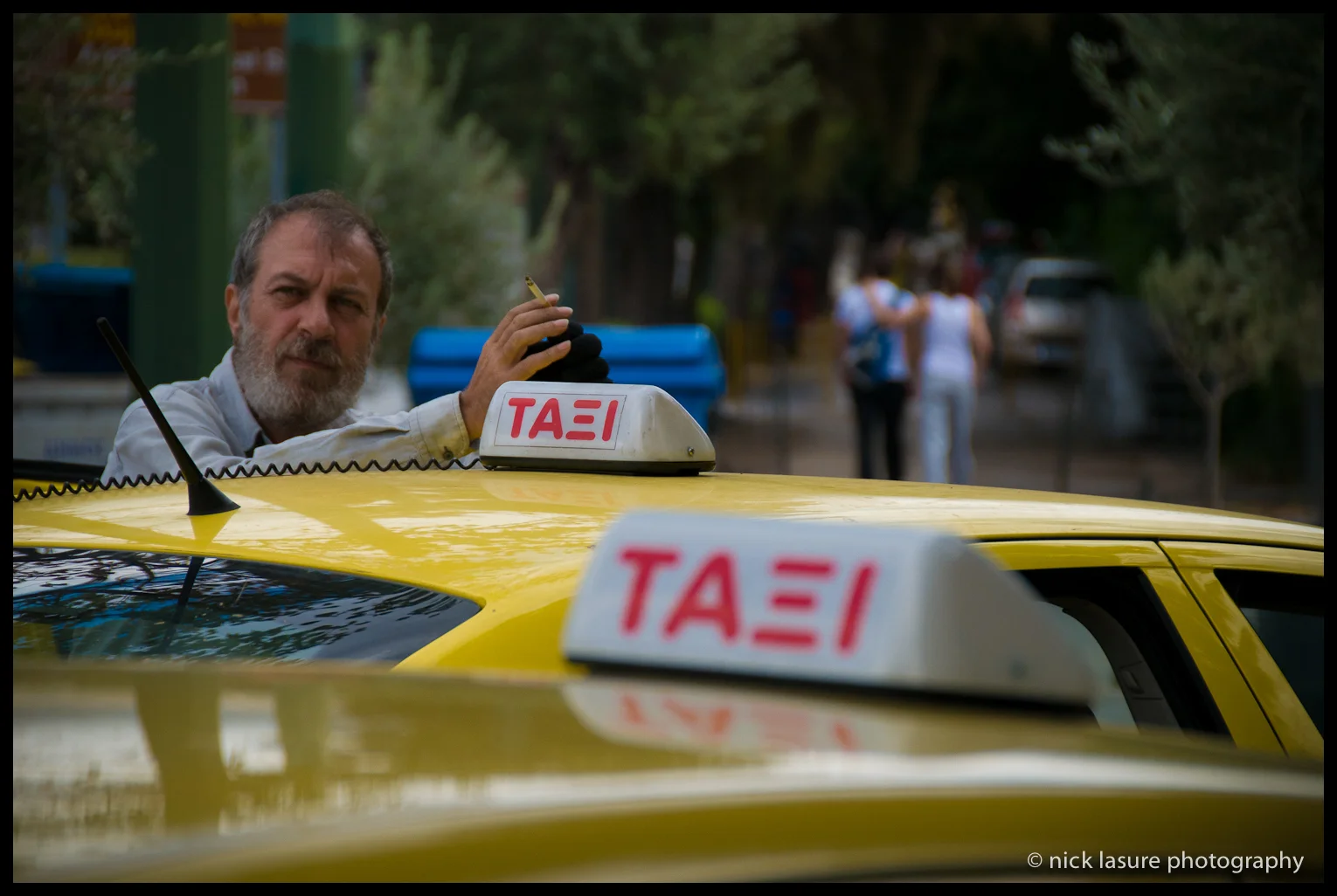 A lot of Greeks seemed pretty upbeat despite the hard times that still persist in the country, this taxi driver appeared to be enjoying a good contemplative cigarette. 