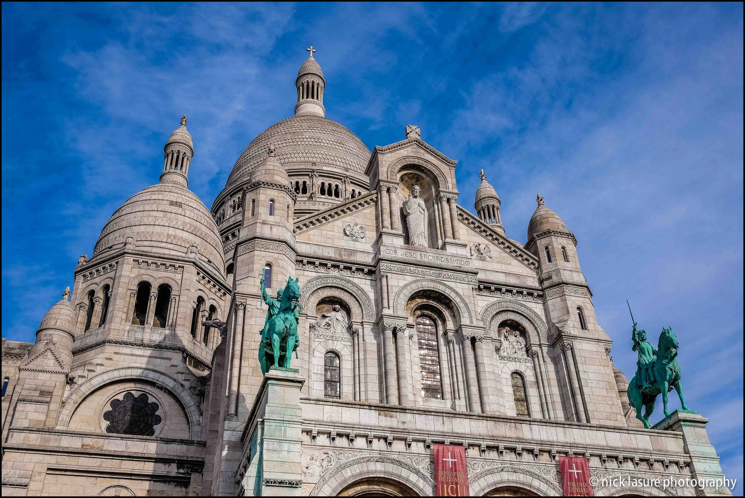 The Sacré Cœur in Paris' Montmartre neighborhood overlooks the city from above // Fuji X-T1