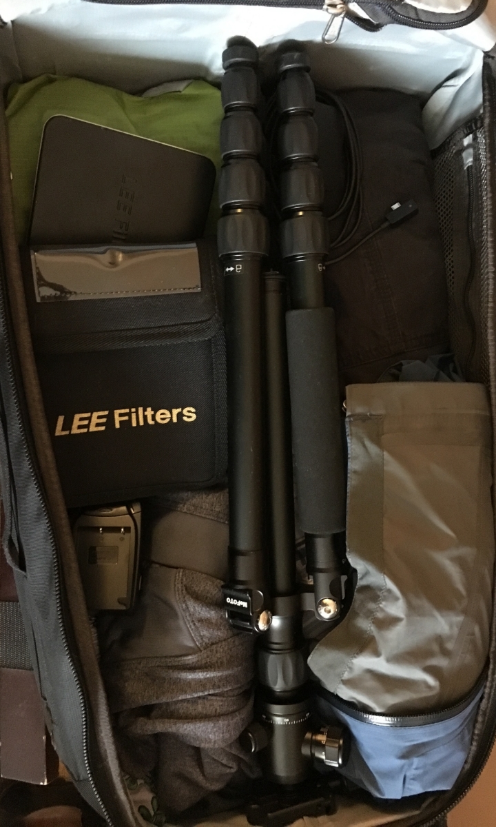 Tripod, filters, charger & accessories snugly fit into my rollerboard bag.