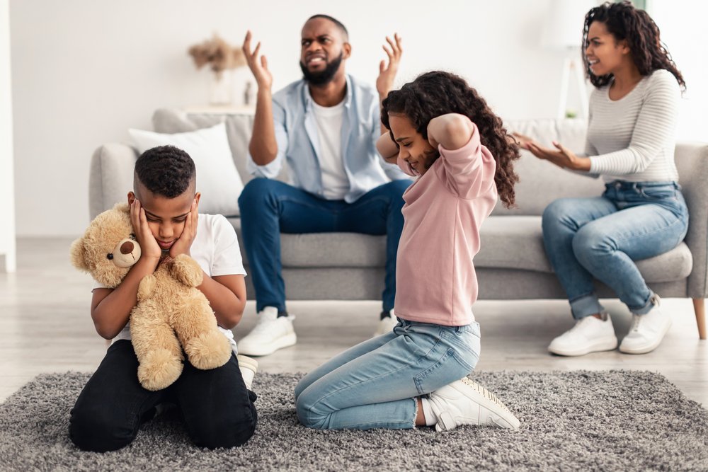 Image of parents fighting in front of their children