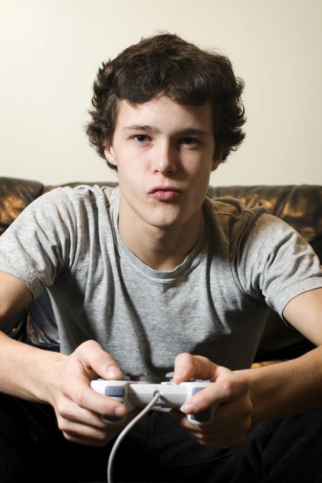 bigstock-Young-Man-Sitting-On-Couch-Pla-4069989.jpg