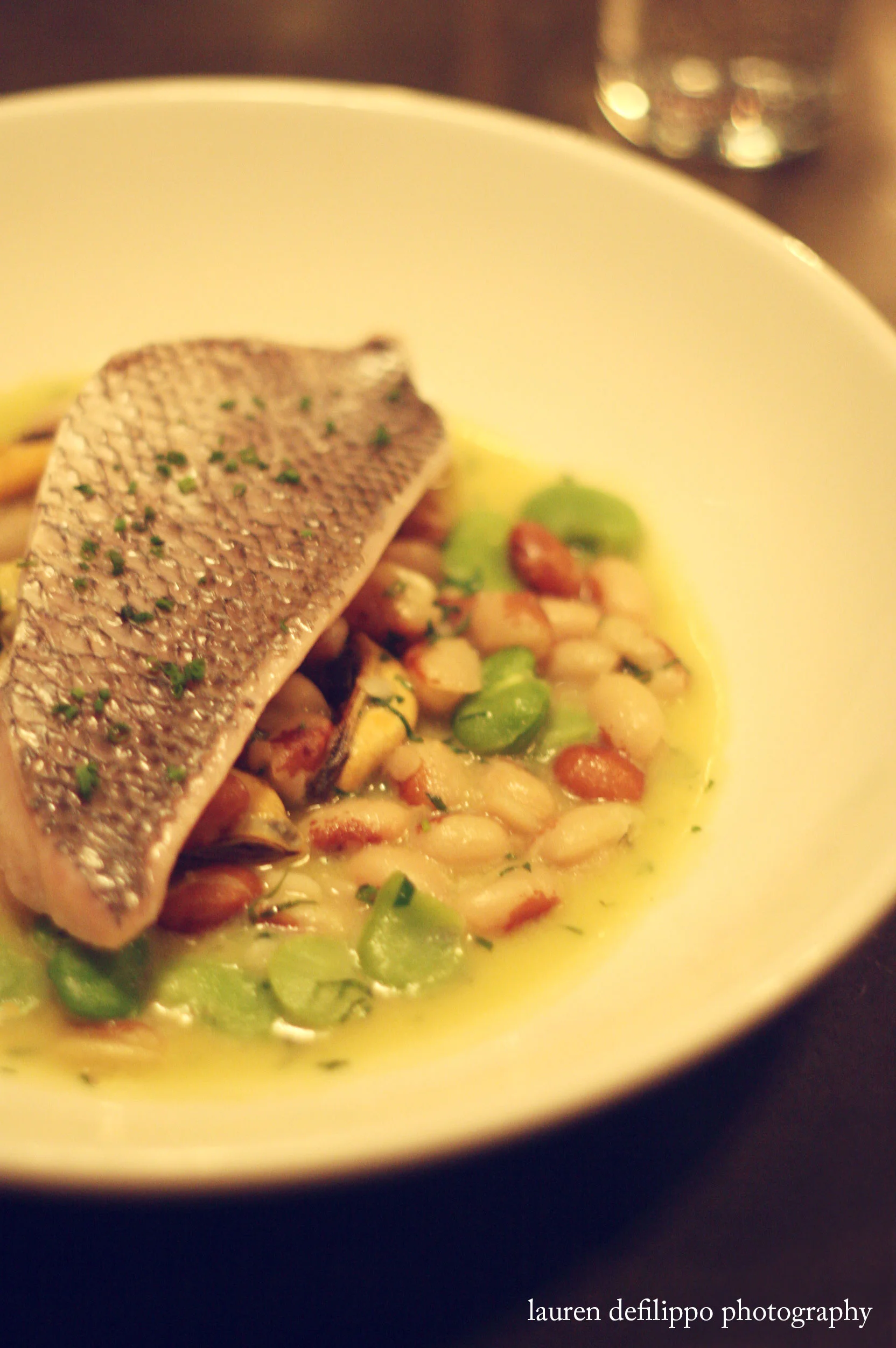 Porgy with fava and yellow eyed beans in green garlic broth