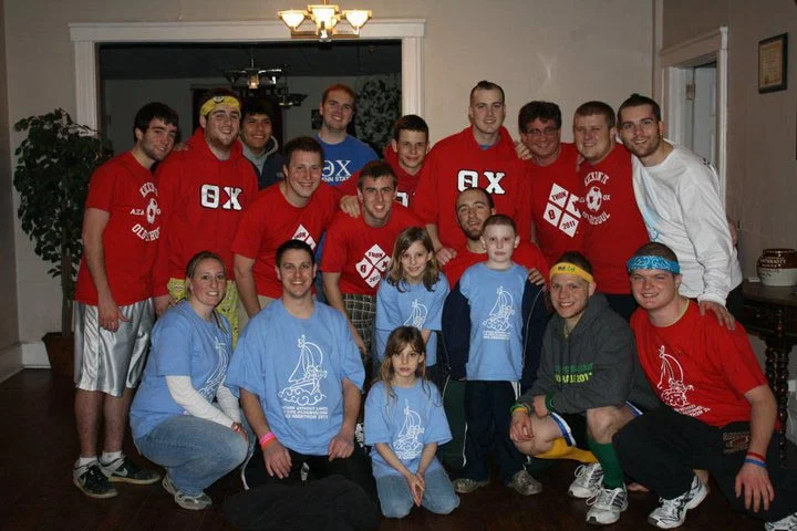 Omega Chapter brothers with the Bobby family 