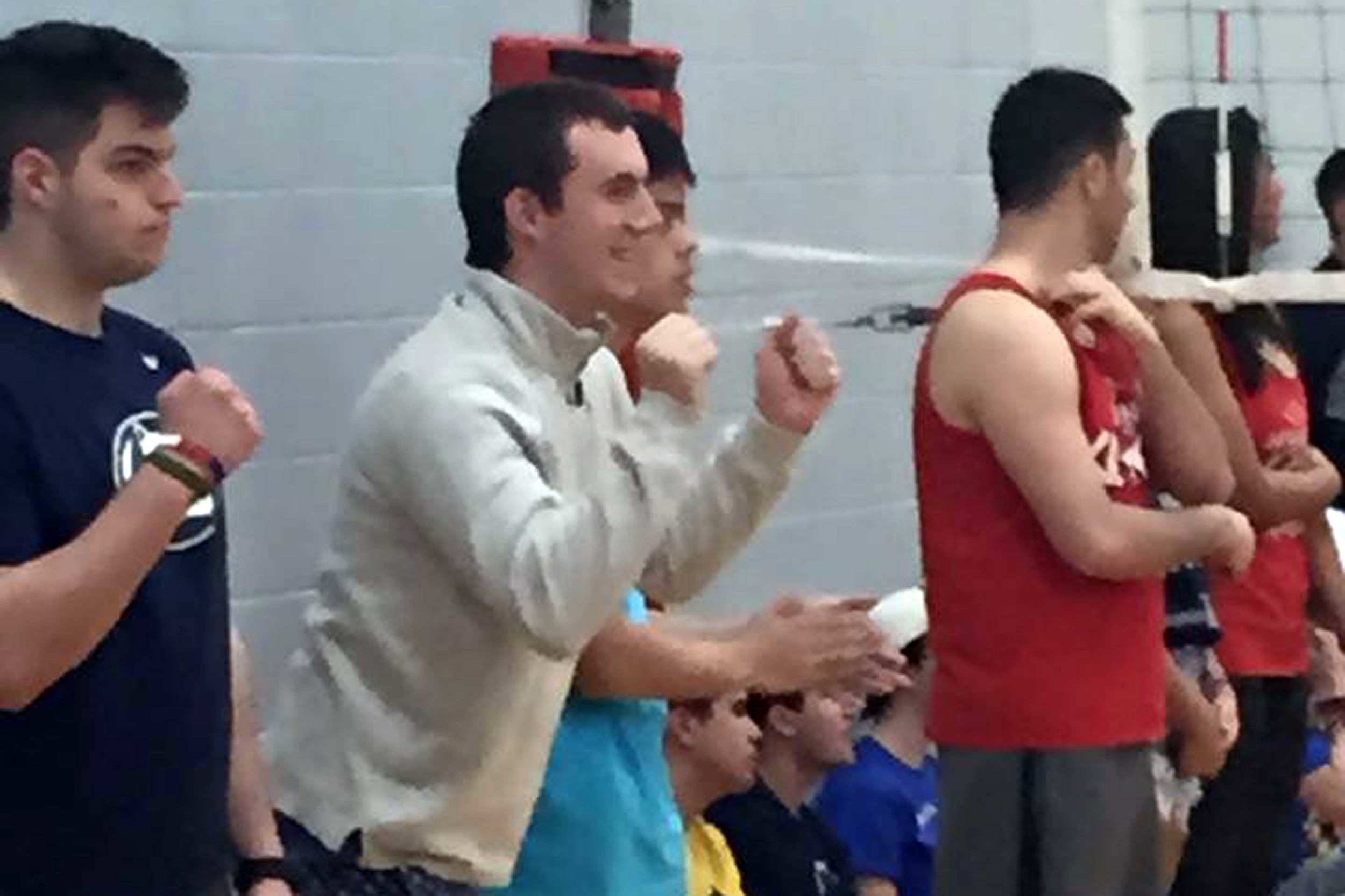  John Broderick cheering on the team during volleyball for 2015 Greek Week 