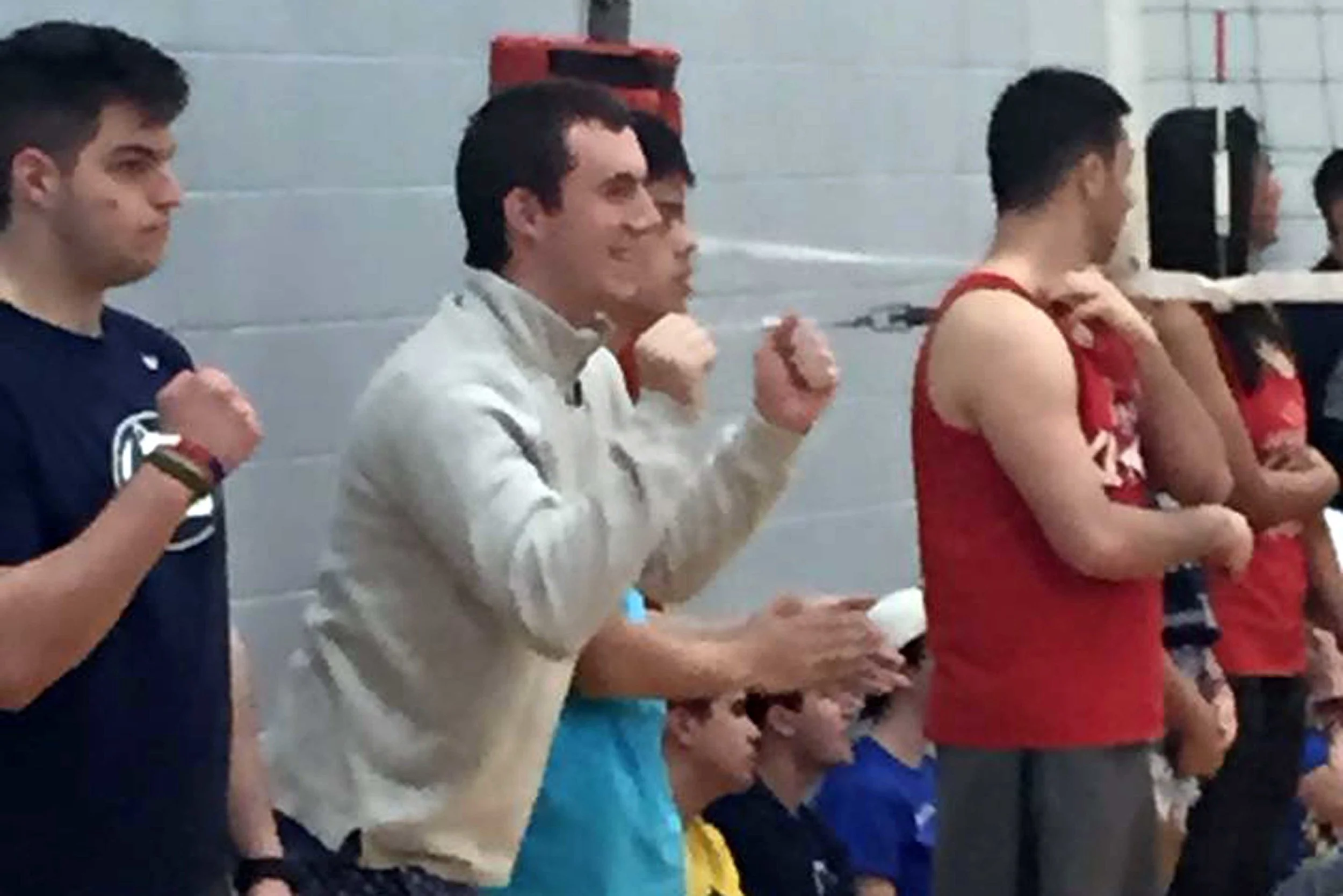 John Broderick cheering on the team during volleyball for 2015 Greek Week