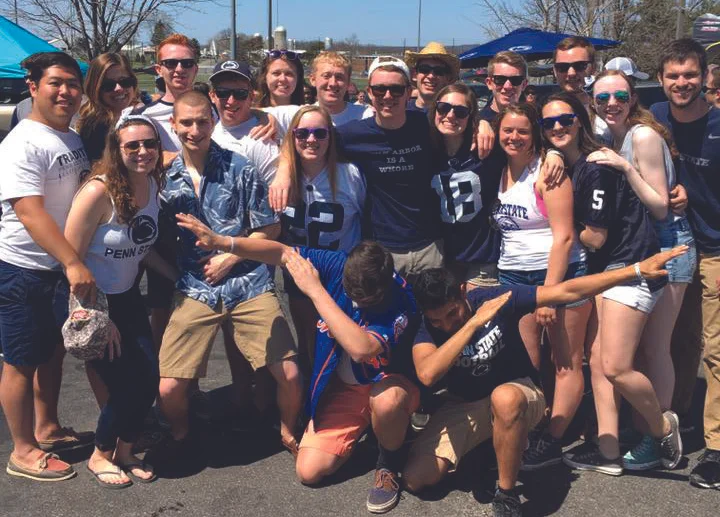 Brothers and friends gather for a tailgate at this year’s Blue- White football game.