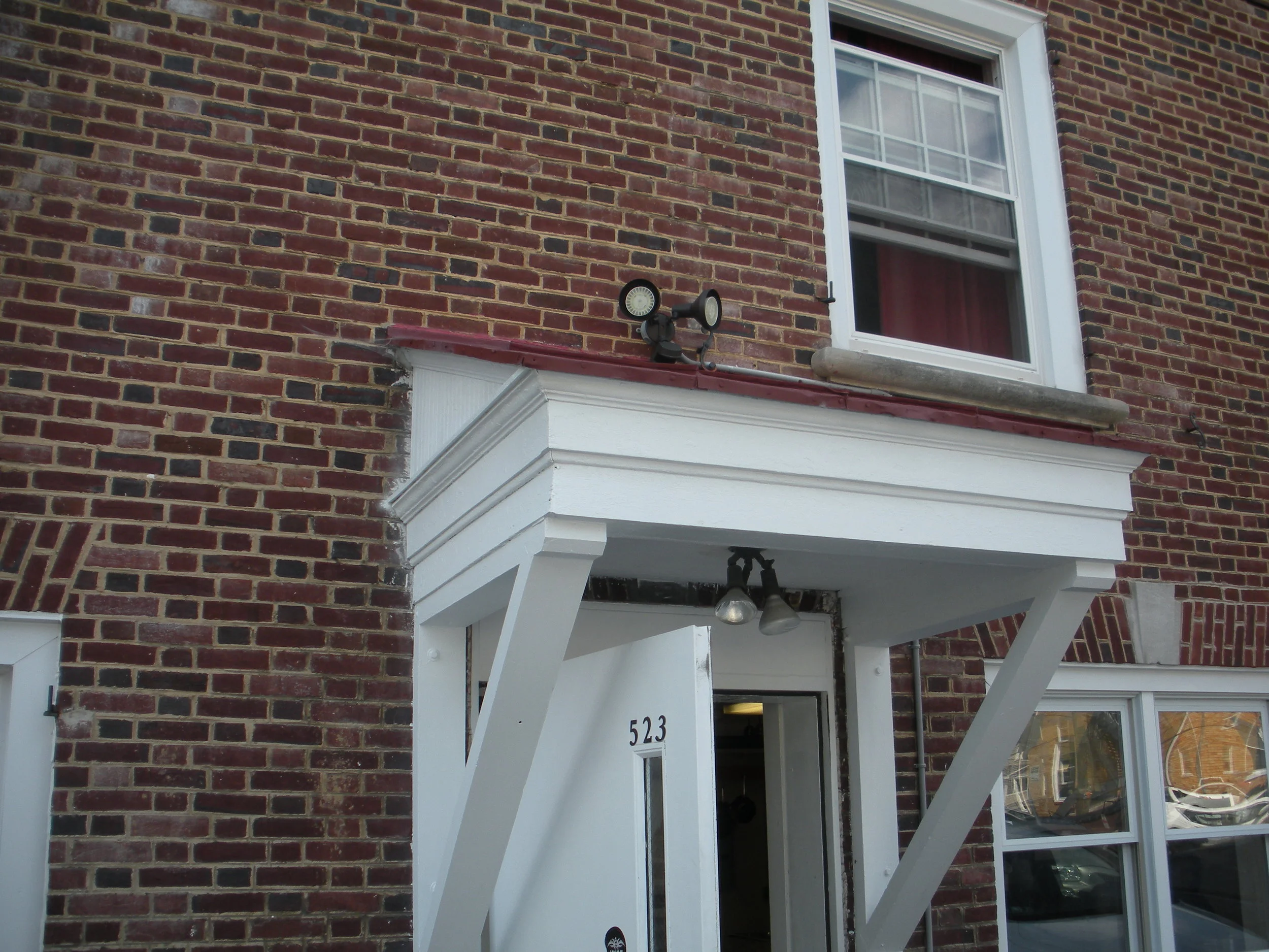  The remaining exterior trim has been repaired and painted, including the cornice work at the top of the house.  